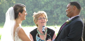 Mixed-race wedding ceremony photo with officiant justice of the peace Janet Moriarty